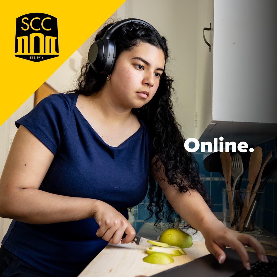 Text over photo of serious woman looking at a laptop computer that says Online next to SCC logo